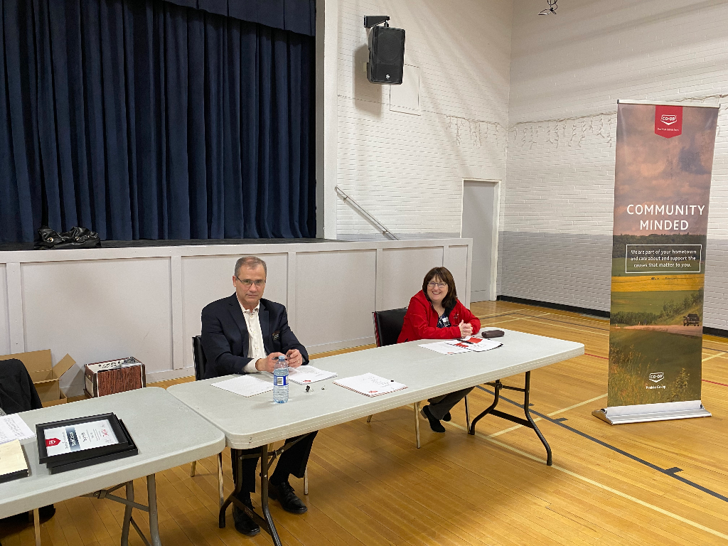 Chris and Tracey wait for the meeting to start.