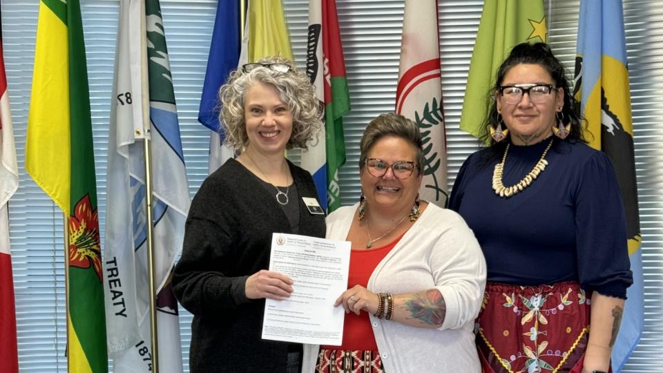 Pictured from left to right:  Kim Wihak, Prairie Co-op; Michele Schwab, Balcarres Community School teacher; Holly Yuzicapi, artist. 